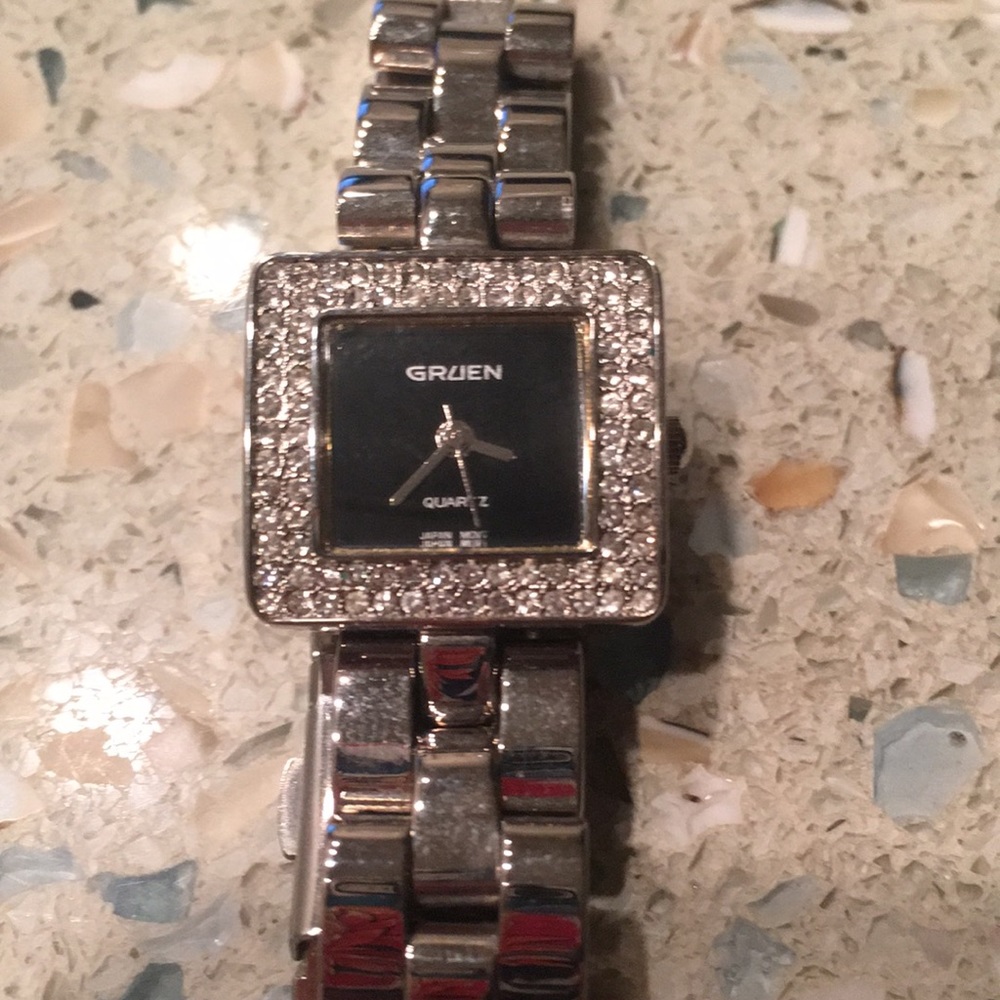 Gruen watch. Black with rhinestones. Stainless steel case. Face = 3/4” square.